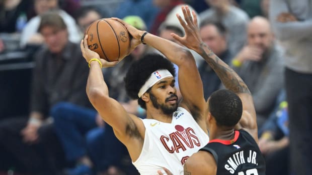 Dec 18, 2023; Cleveland, Ohio, USA; Cleveland Cavaliers center Jarrett Allen (31) looks to pass beside Houston Rockets forward Jabari Smith Jr. (10) in the first quarter at Rocket Mortgage FieldHouse.